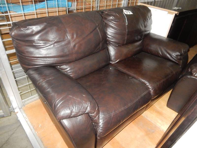 Simulated leather reclinging Love Seat. Electric Recline