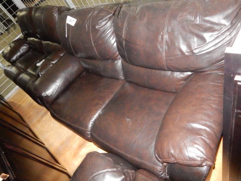 Simulated leather reclining Love Seat.. Electric recline..