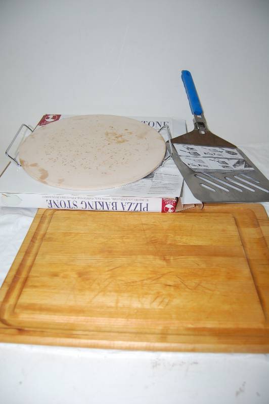 lot 124 image: Pizza Stone with Pizza Paddle and Cutting Board