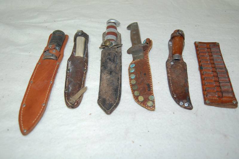 lot 375 image: Knives, Leather Bullet Holder, and Misc Sheaths