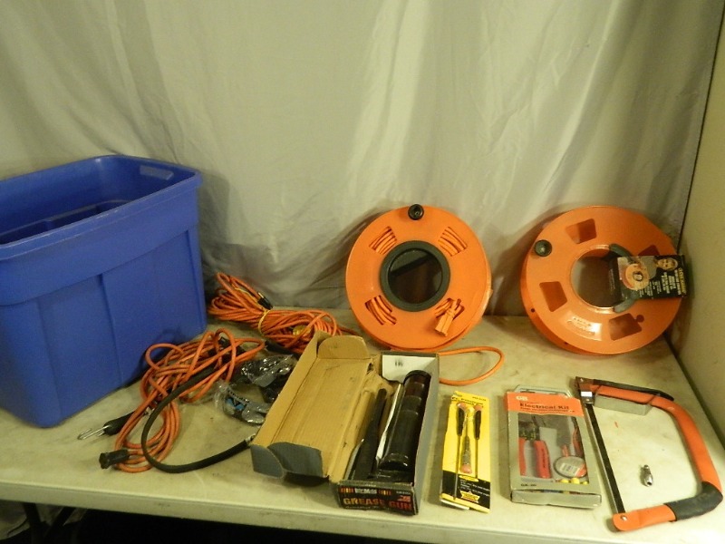 lot 64 image: Extension Cords, Grease Gun, Tools, and More