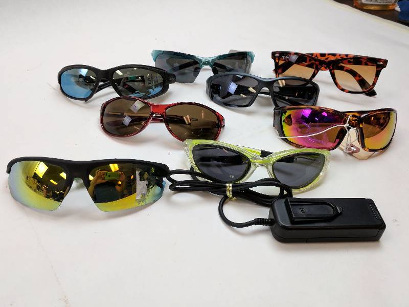 lot 62 image: Lot of 8 Pairs of Sunglasses (1 Fake Pair Of Ray Ban)