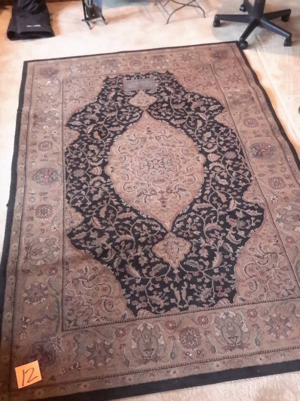 lot 12 image: Wool rug..   53 in x 96 in.. Nice shape