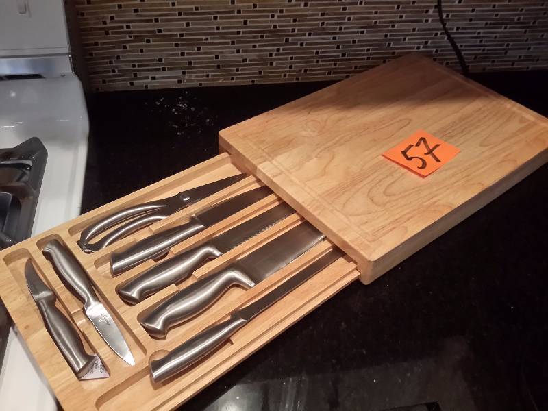 lot 57 image: Cutting board with Cutlery set that slides inside.