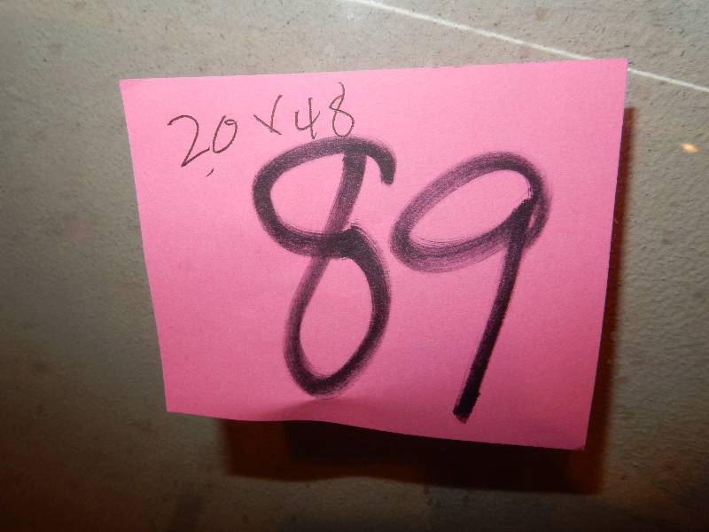 lot 89 image: 20in x 48 in piece of heavy glass for table top. Rounded corners