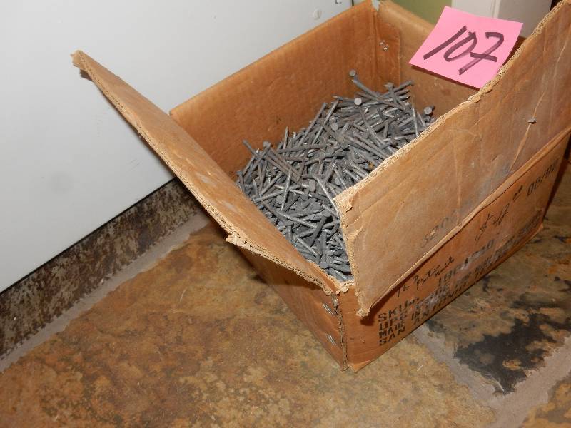 lot 107 image: 34 of a box of nails as pictured