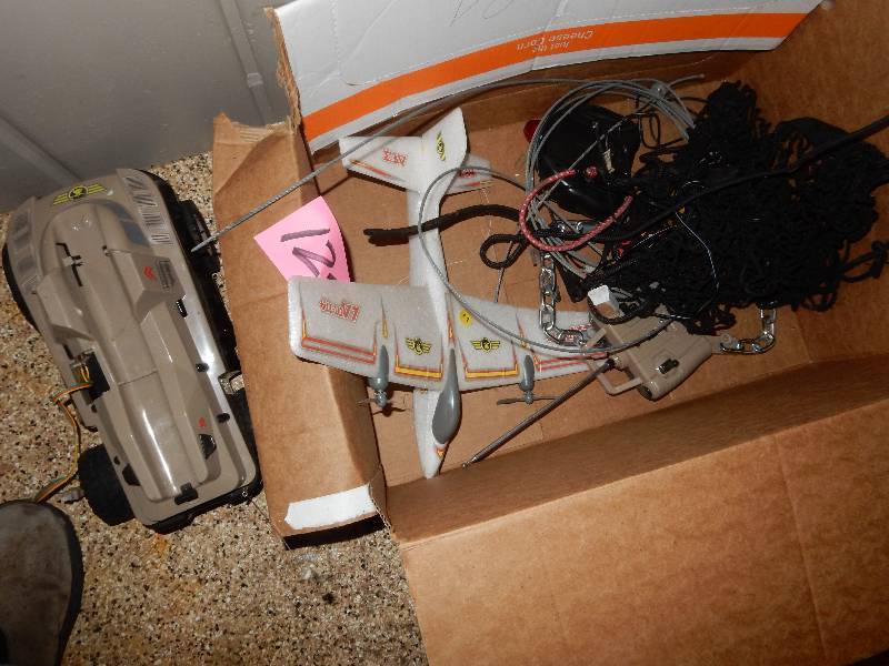 lot 125 image: Remote car and Remote Airplane.. These are untested. He got these at another auction and never used them so not sure if they work..   Please inspect.