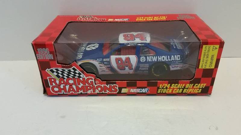 lot 11 image: 1996 Racing Champions Ron Barfield #94 New Holland Ford 124 Scale Die Cast Metal Car