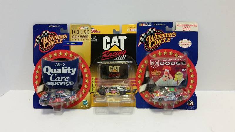 lot 87 image: Winners Circle #19 Jeremy Mayfield Muppets Dodge Intrepid, #88 Dale Jarrett Ford Quality Care Service & #96 Dave Green Caterpillar cars