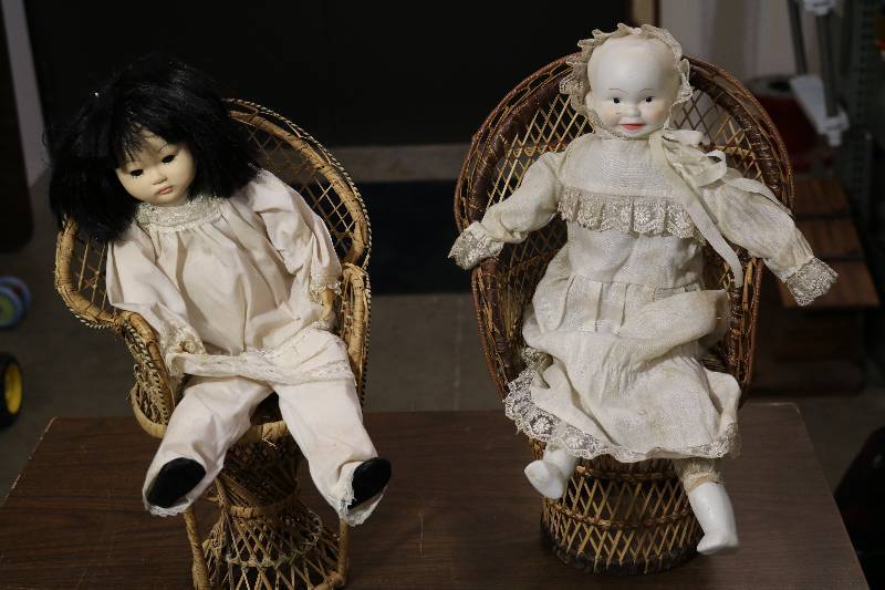 Dolls in Wicker Chairs