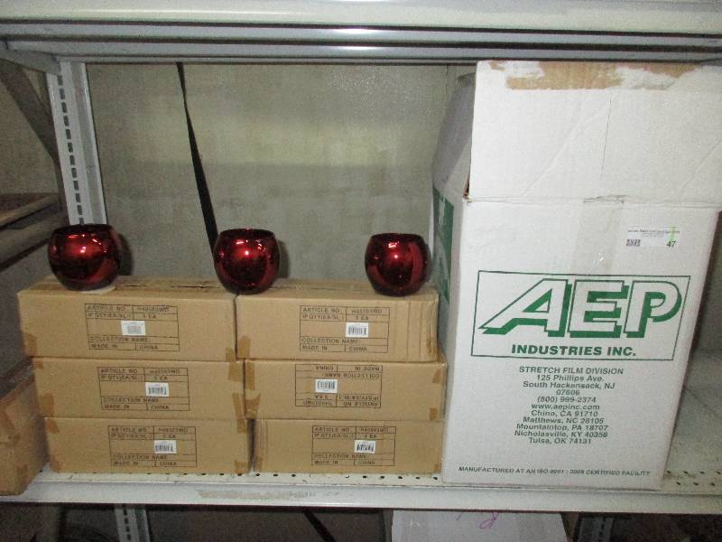 lot 47 image: huge box of 3.35 red tealight holders and 6 cases of 3