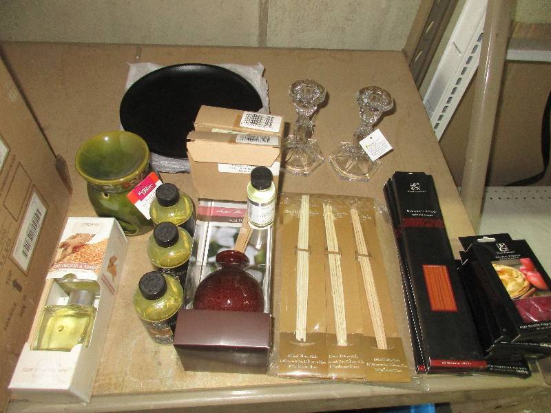 lot 69 image: misc smell good stuff -- wax burner and wax --candle holders -- liquid insence and diffuser sticks --and incense