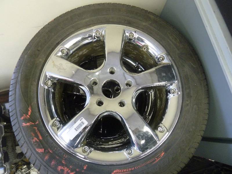lot 499 image: Four Goodyear Tires with 16 Chrome Rims