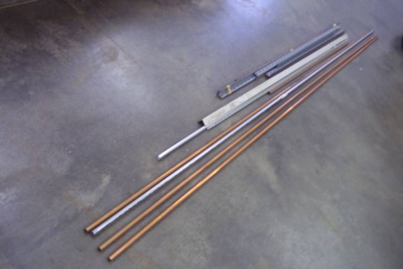 lot 150 image: Lot of 12 Copper Pipes, Shelf Rails, and brackets