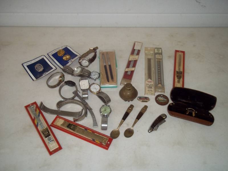 lot 40 image: Watches, watch bands, brass bell and more