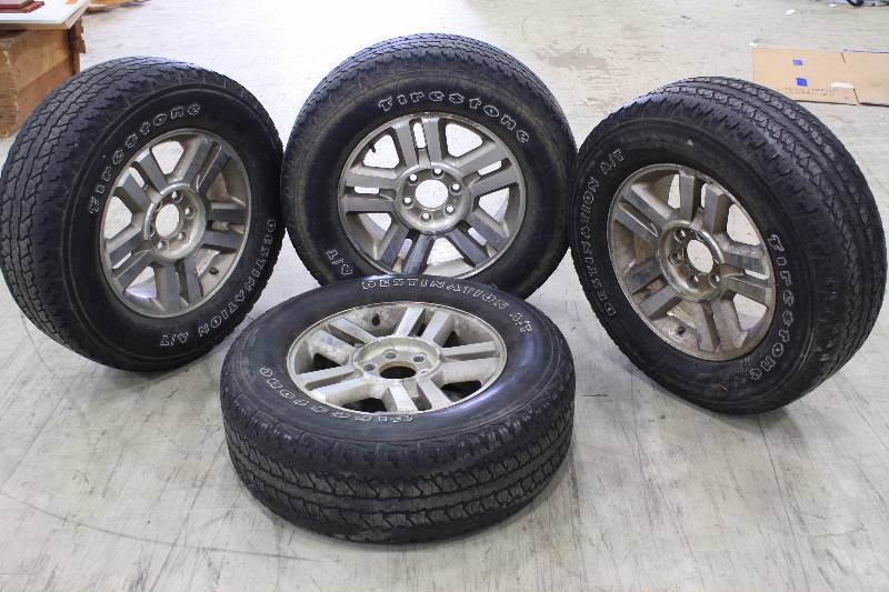 lot 7 image: Set of 4 Ford F150 Rims and Tires