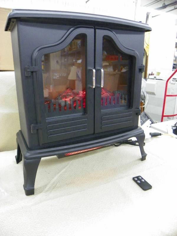 lot 485 image: Alcove Randal Electric Stove Heater, with remote and owners manual