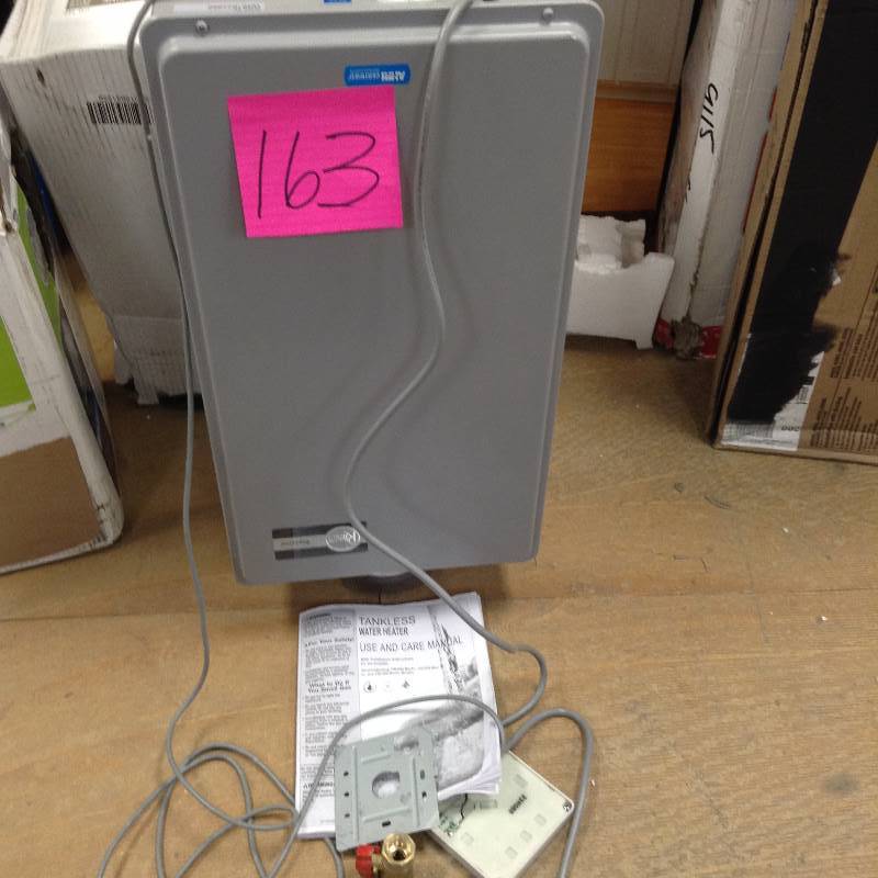 lot 163 image: Rheem EcoSense  Tankless Gas Water Heater open box in like new condition see pictures