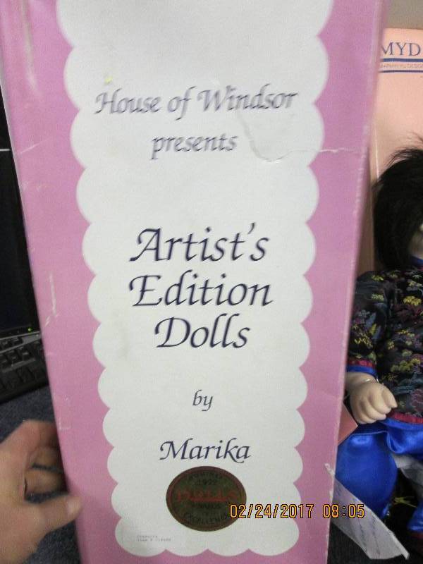 2 dolls both look new ...