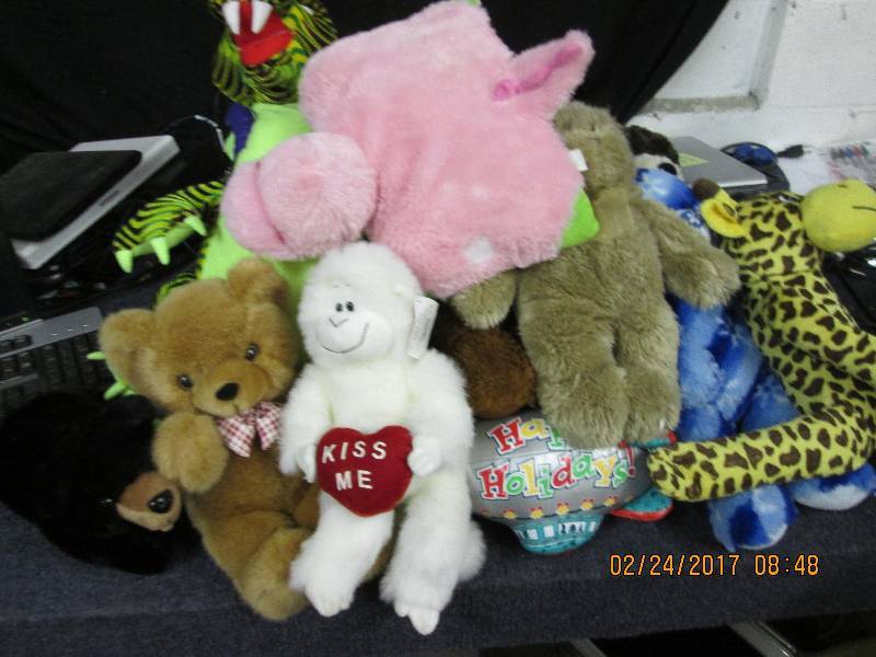 lot of stuffed animals most look ne...