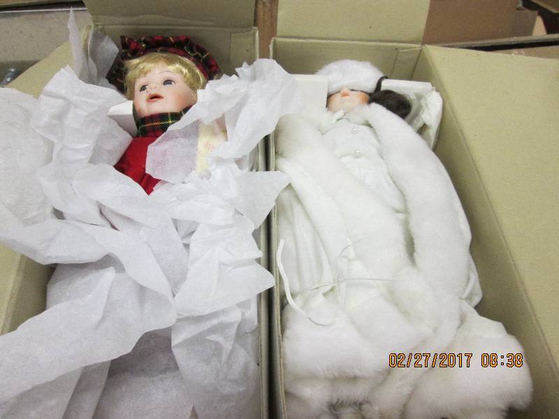 2 dolls both look new ...