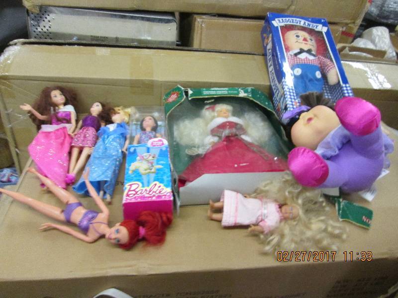 lot of barbies a raggedy andy and o...