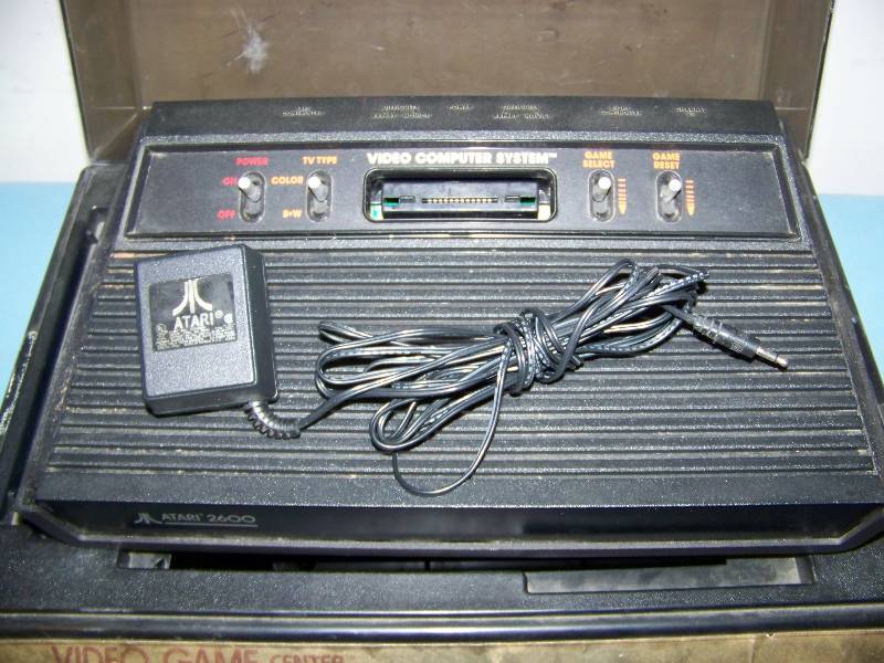 lot 38 image: Vintage  Collectible, Atari 2600 Gaming Console with Games and Controllers in Atari Storage Case