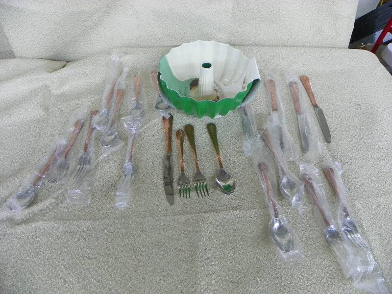 lot 516 image: Jessamine Copper Mirror 20 Piece silverware set, MSRP $99.99 AND Green Bundt Cake Pan, MSRP $24.99