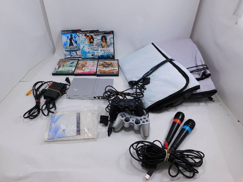 lot 45 image: Lot of Playstation 2 Games - Dance Pad & Microphones Included