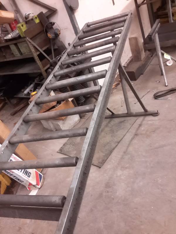 lot 48 image: Roller assembly. 10 ft long.  Adjustable Height