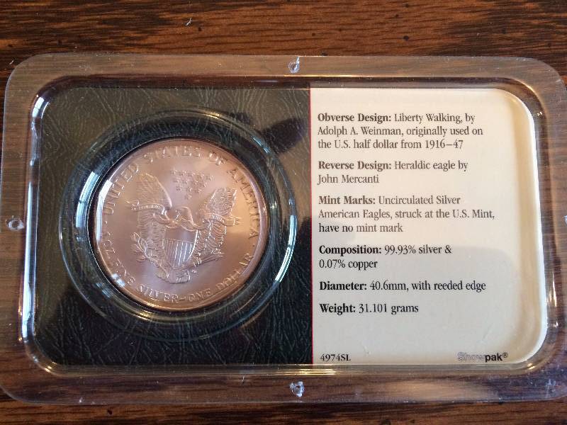 lot 187 image: Collectible Uncirculated 2002 31.101 Grams Silver American Eagle by Littleton Coin Company