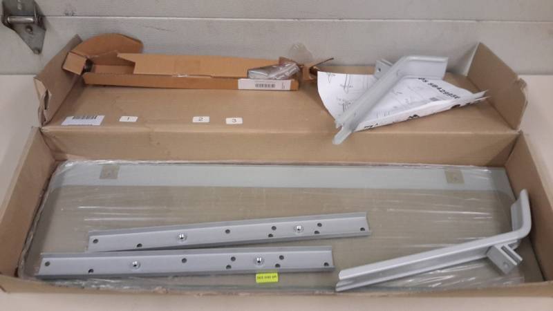 lot 99 image: New in the box glass wall shelf