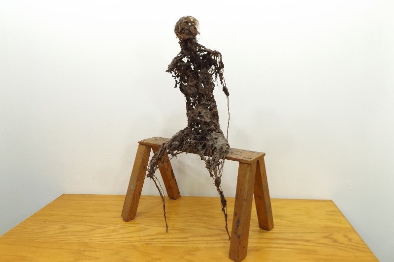 lot 4 image: Creepy 28 Wire Sculpture of a Person Figure Sitting on a Wood Bench