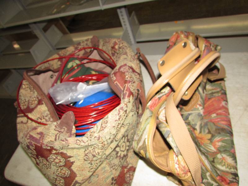 lot 19 image: 2 travel bags, dog tie out chain and kids helmet