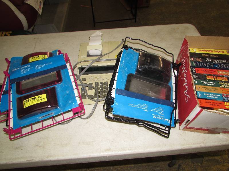 lot 48 image: Locker caddies, VCR Movies and calculator