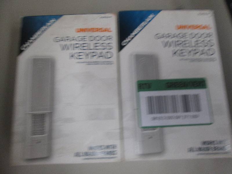 lot 84 image: 2 universal wireless garage door ke...