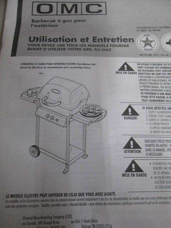 lot 215 image: omc gas grill looks unused needs as...