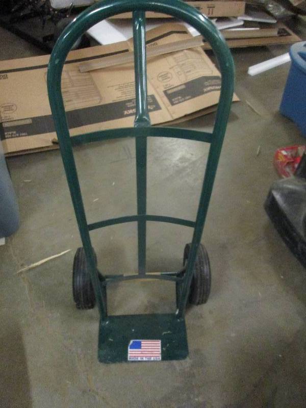lot 365 image: 600lb steel loop dolly needs air in...