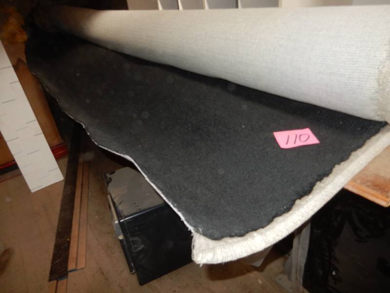 lot 110 image: roll of Black carpet. Not sure of length, but 12 ft. long.. NEW