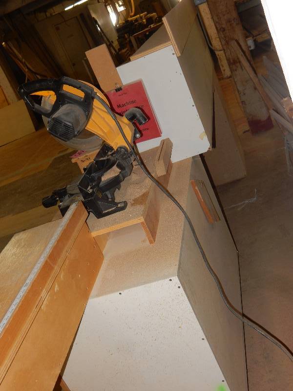 lot 140 image: Chop Saw Table 16 ft. long.. On casters.  SAW NOT INCLUDED