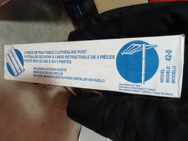 lot 19 image: NEW 3 Pc Retractable Clothes Line Post. Includes Ground Sleeve.