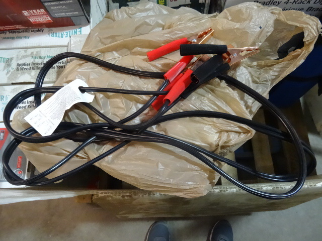 lot 21 image: NEW  Jumper Cables, appear to be 12 ft. Missing Retail Packaging Retail $29