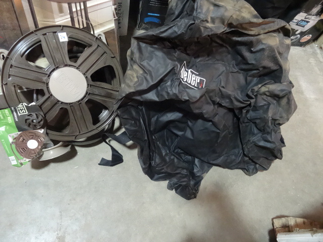 lot 24 image: NEW 2 Pc Lot Ames Wall Mount Hose Reel 100ft capacity and Weber Grill Cover (very dusty) Retail Combined $94