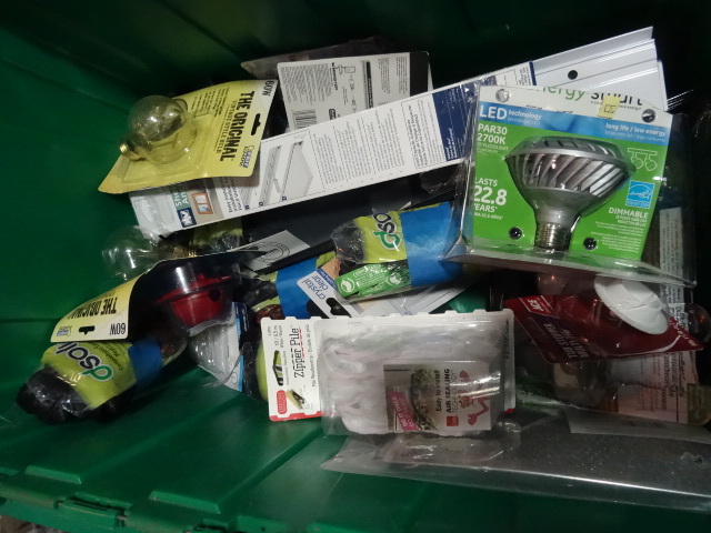 lot 86 image: NEW ENTIRE BIN Hardware Items, Incl. Dusk to Dawn Light Control, LED Light Bulbs, Shelf Anchors, Compost Bags, and MORE. GREEN BIN NOT INCLUDED