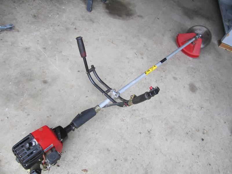 lot 19 image: Gas powered brush cutter...