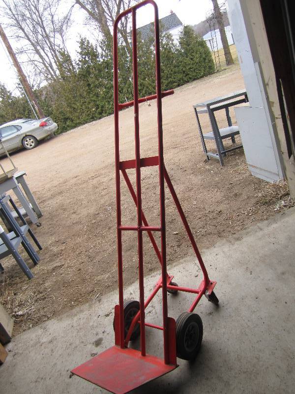 lot 31 image: Tall tilting wheeled dolly cart...