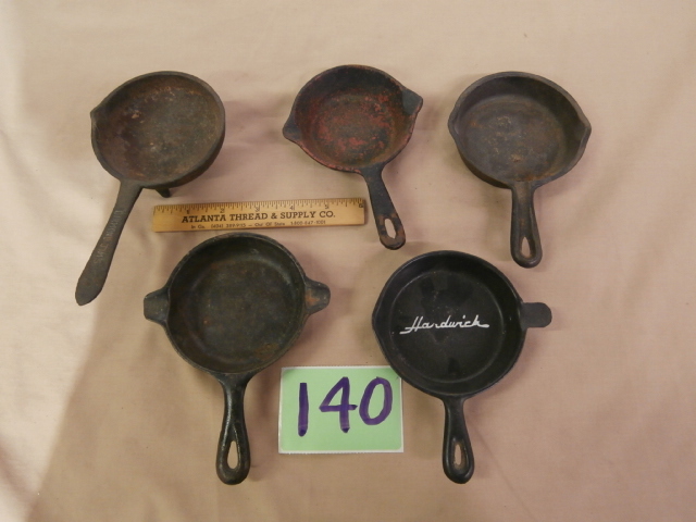 lot 140 image: Group of Mini Cast Iron Fry Pan Ashtrays