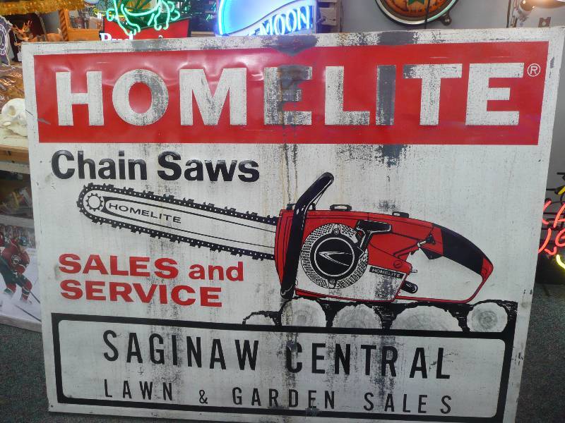 lot 5 image: Embossed Homelite Chain Saw Sign - Approx 58wide 46high