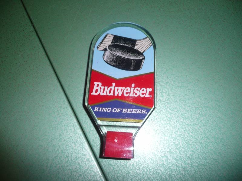 lot 17 image: NOS Hockey Puck & Stick Budweiser Tap Handle