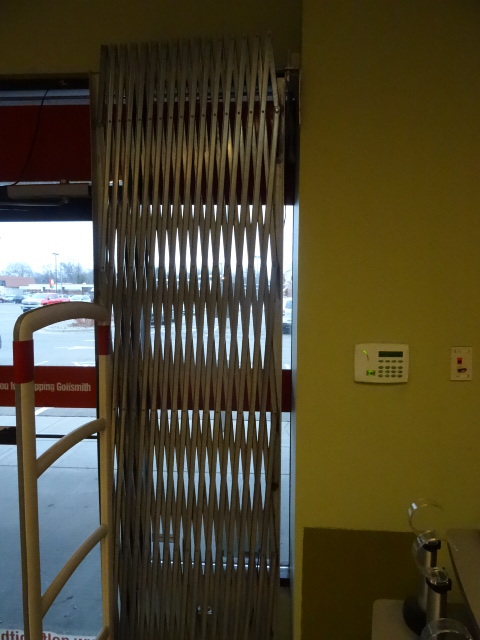 lot 12 image: Accordian security gate. Complete unit. 96 tall. Expands to 10